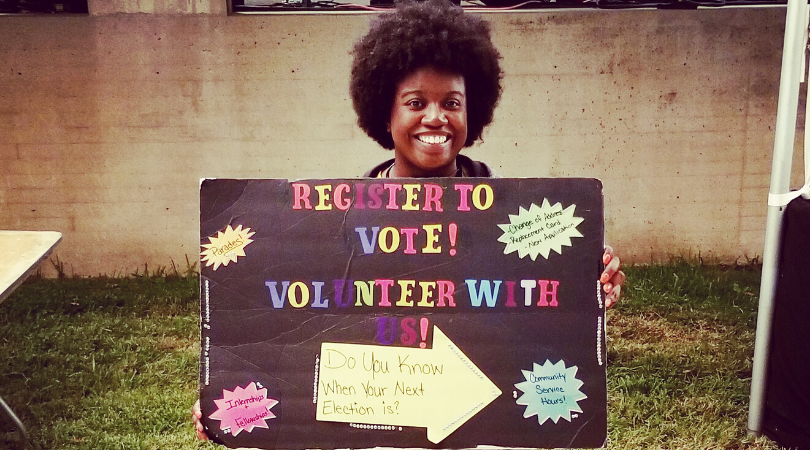 Armetta Lashun holding a poster