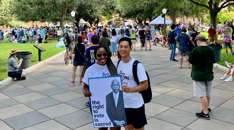 Delilah Agho-Otoghile holdin a poster