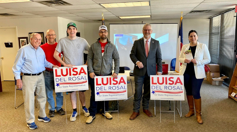 Luisa del Rosal with her supporters holding her campaign poster