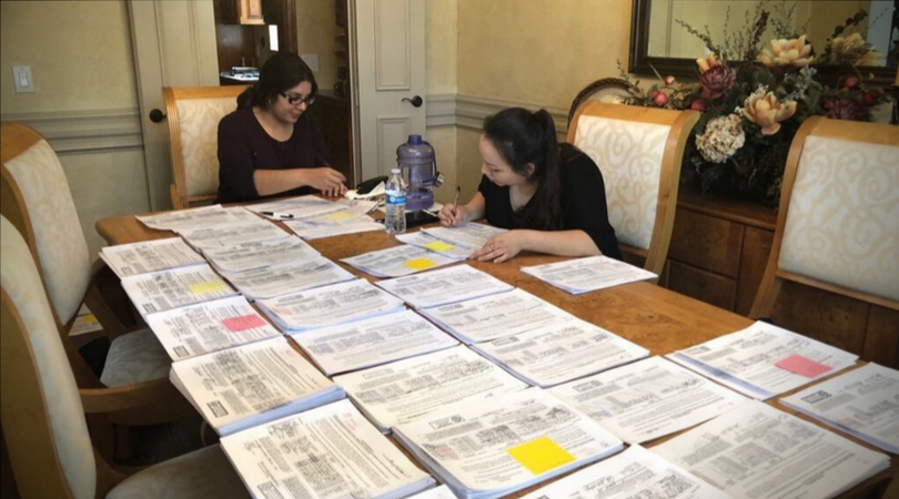Tania Rodriguez reviewing papers