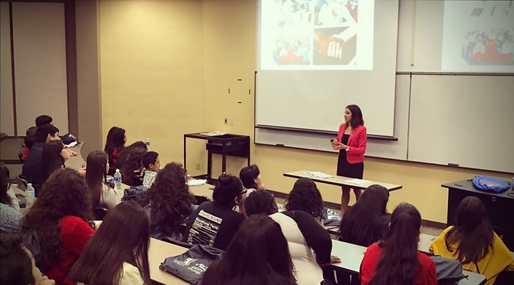 sasha moreno discussing in front of the students